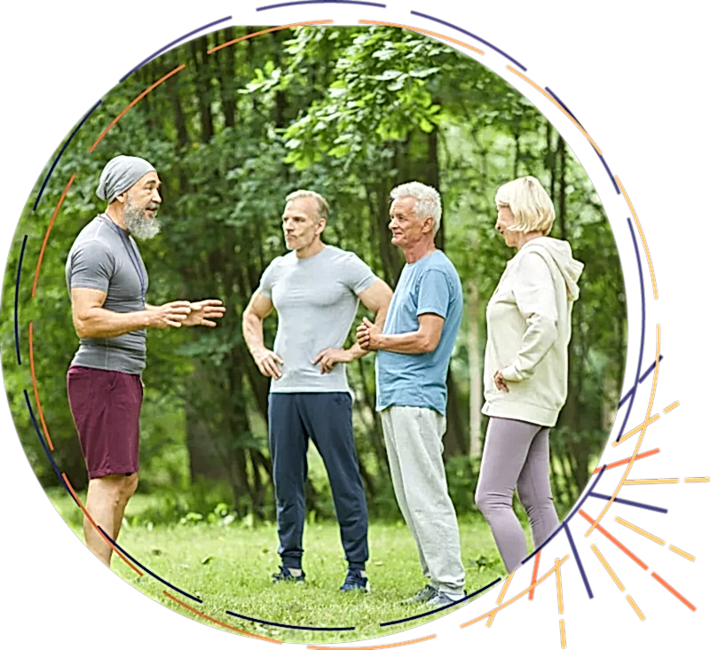 Group of middle age people standing outside talking about the Ignition program